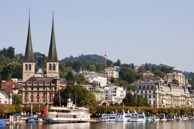 Tourist ship beside the Hofkirche on Lake Lucerne