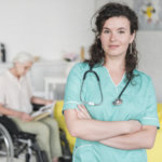 portrait-young-female-nurse-standing-front-senior-woman-sitting-wheel-chair_23-2147861542